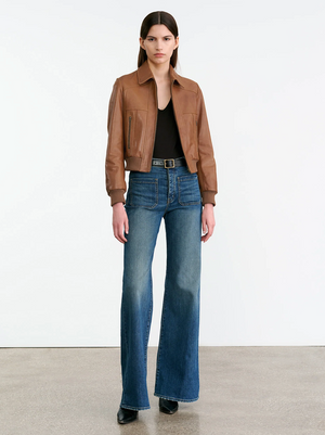 Close-up of the Sue Leather Jacket in Cognac, showcasing the novelty seam details and rib trim.