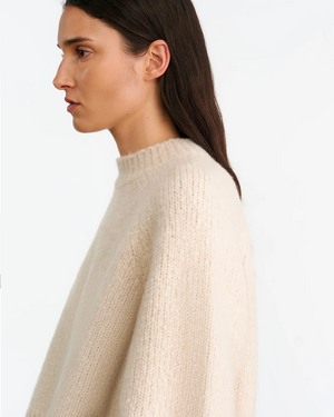 Tomaso Sweater in Beige Melange laid flat, illustrating its heavyweight and relaxed silhouette.