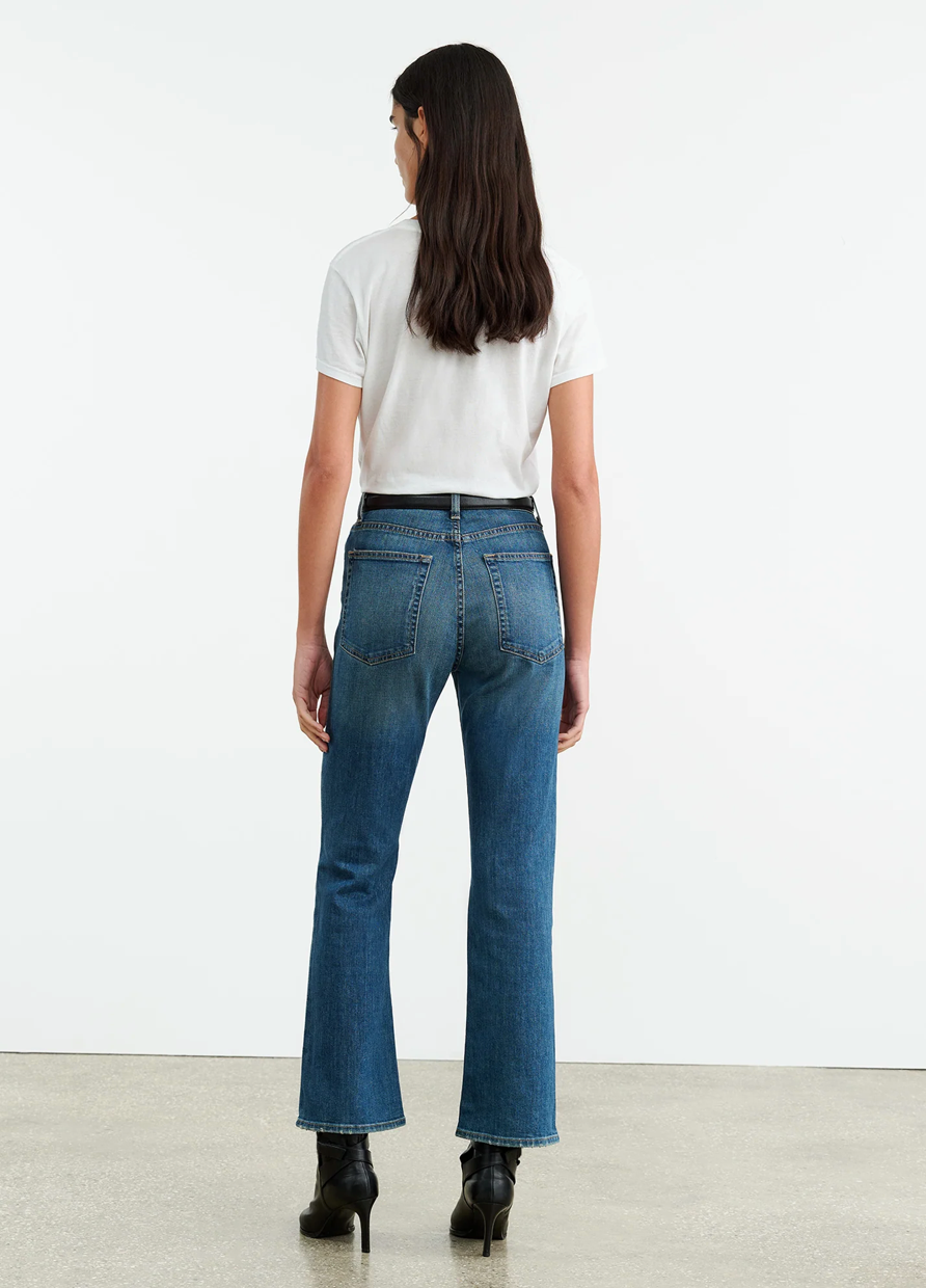 Close-up of Nili Lotan Boot Cut Jean in Classic Wash, featuring the mid-rise fit and zip fly.