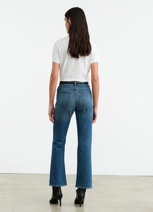 Close-up of Nili Lotan Boot Cut Jean in Classic Wash, featuring the mid-rise fit and zip fly.