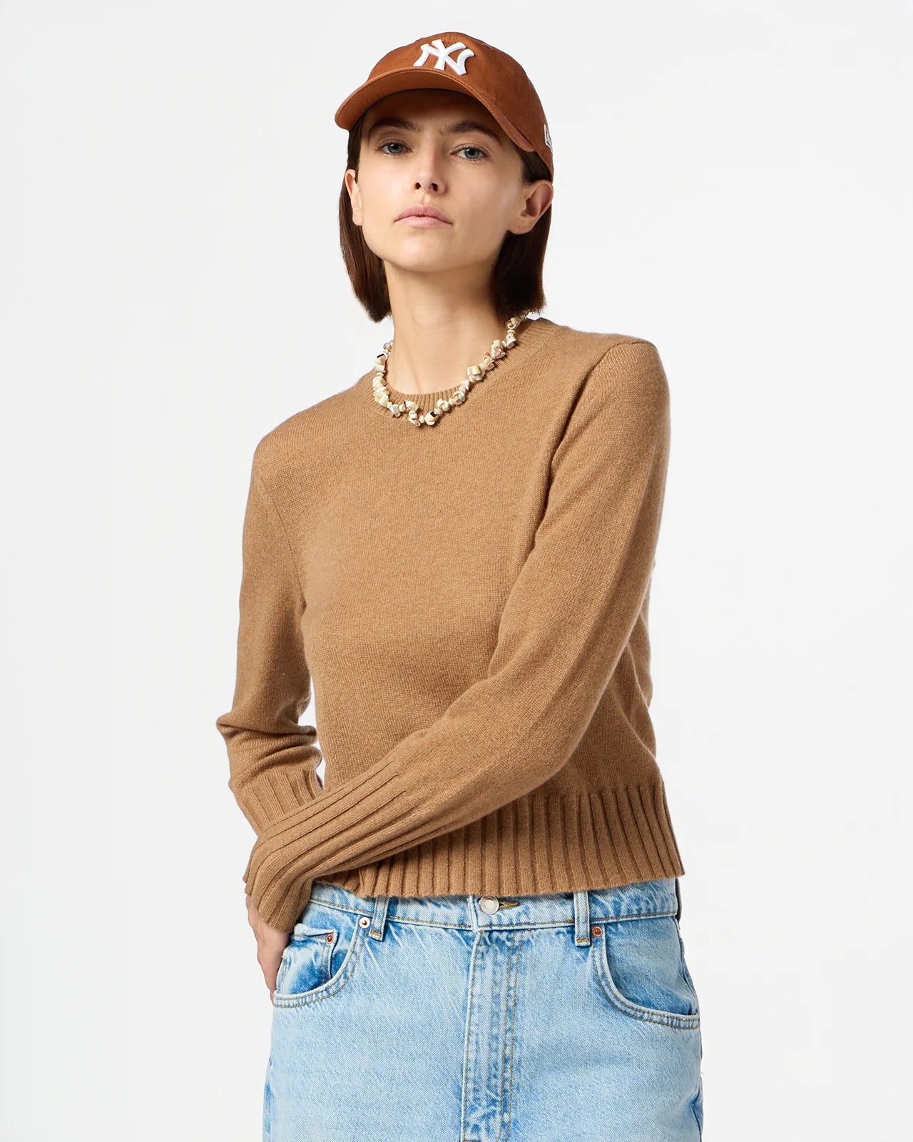 Fashion shot of Shrunken Crew in Almond on display, capturing its elegant style and neutral color.
