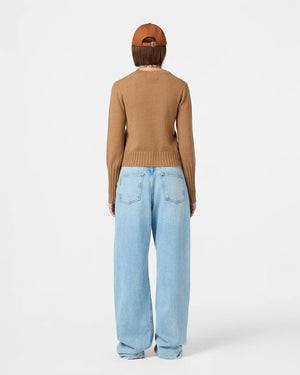 Back view of Shrunken Crew in Almond emphasizing rib trim hem and branding.