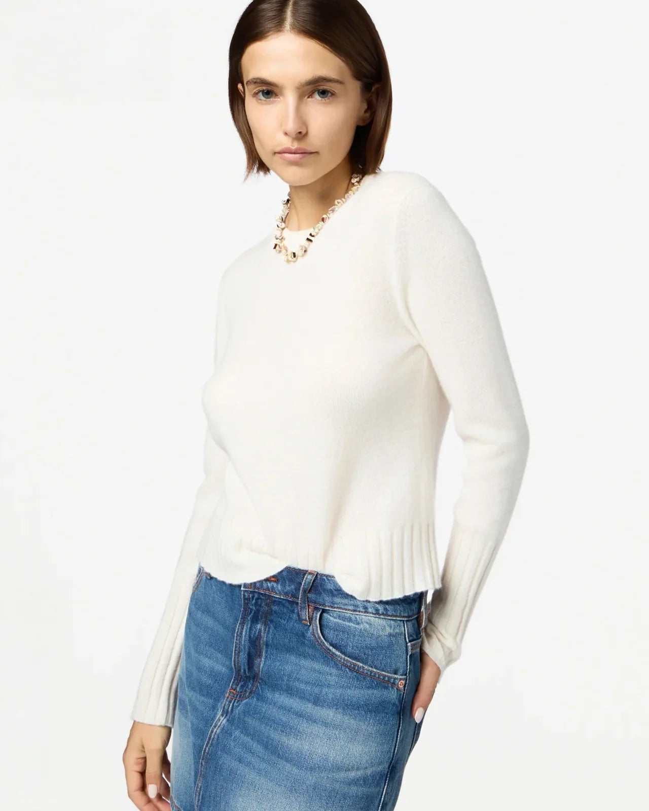 Flat lay of Shrunken Crew in Cream showing its luxurious texture and casual style.