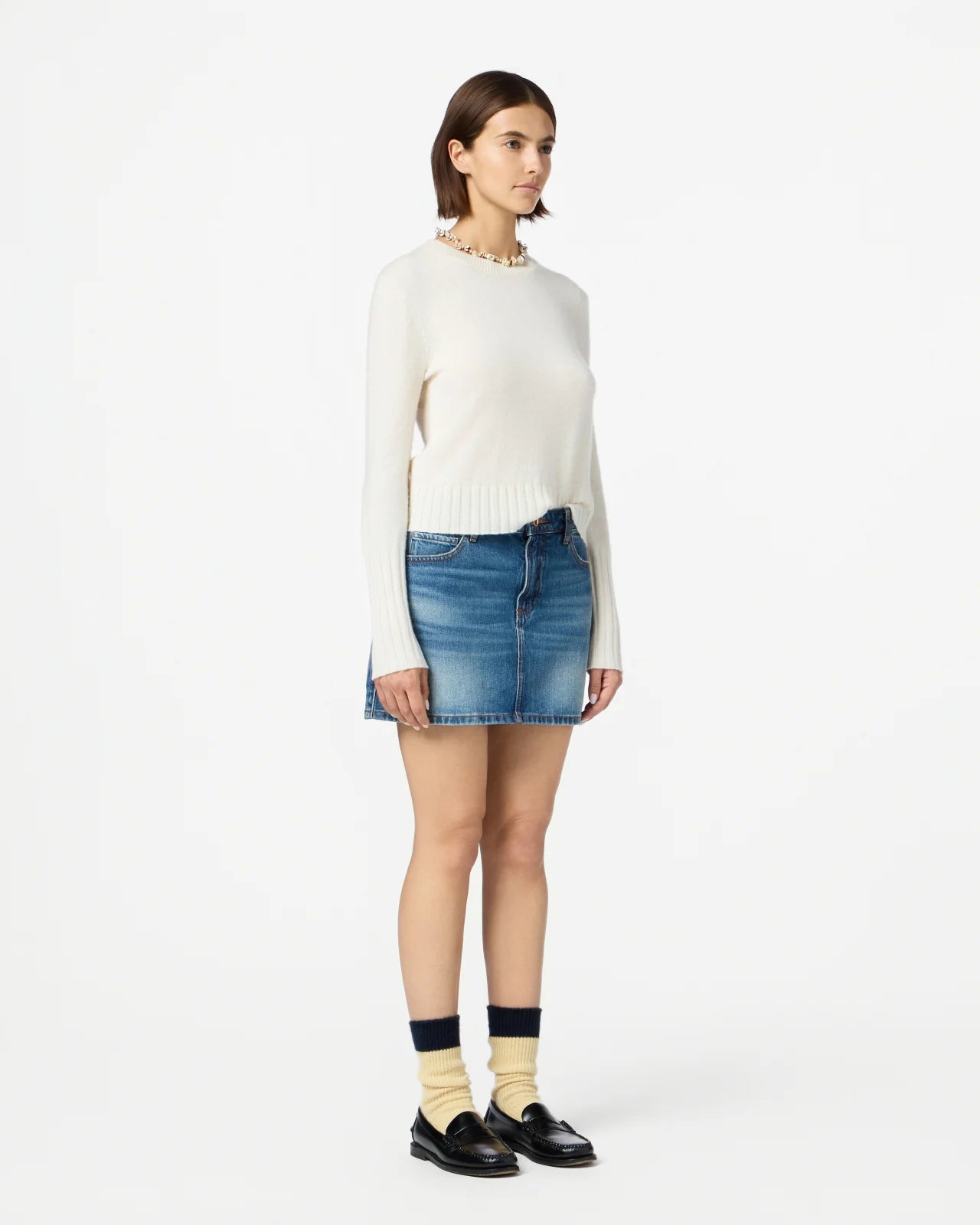Back view of Shrunken Crew in Cream highlighting signature branding and stylish rib trim hem.