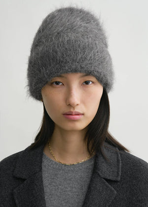 Close-up view of the Alpaca Beanie Hat in Dark Grey Melange, highlighting the intricate knit pattern and fuzzy alpaca blend material by TOTEME.