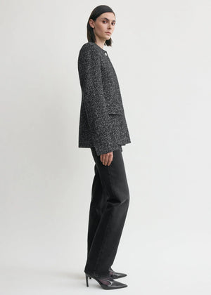 Model wearing the Collarless Cinched Jacket in Black/White, demonstrating its stylish fit and cinched waist.