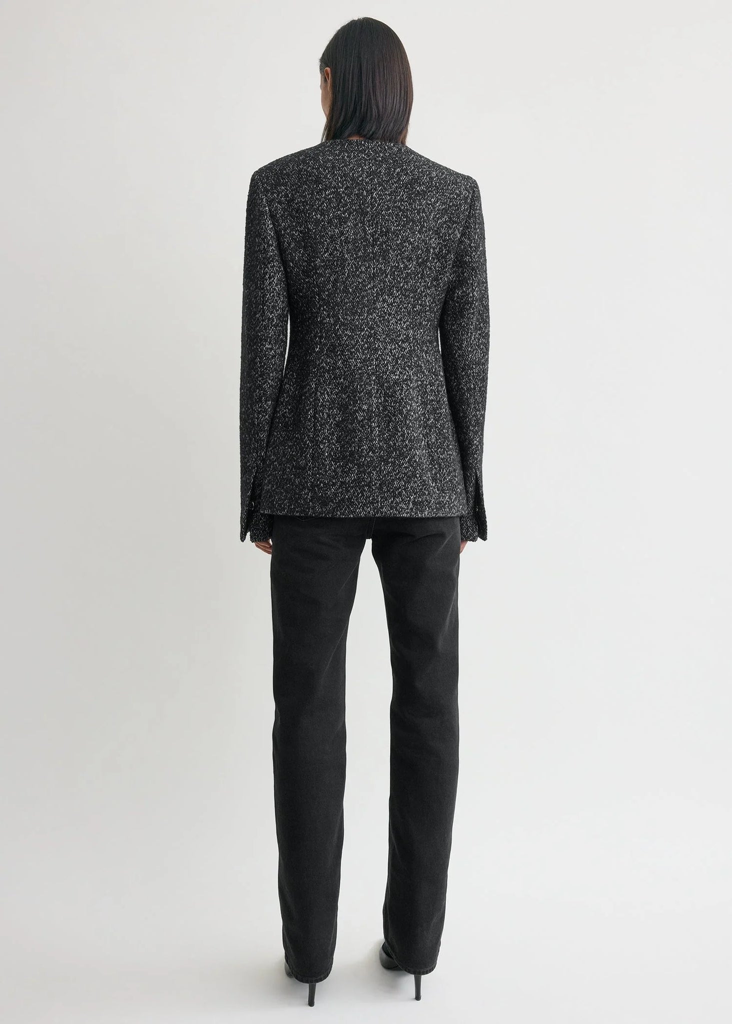 Back view of the Collarless Cinched Jacket in Black/White featuring the flap pockets and full satin lining.