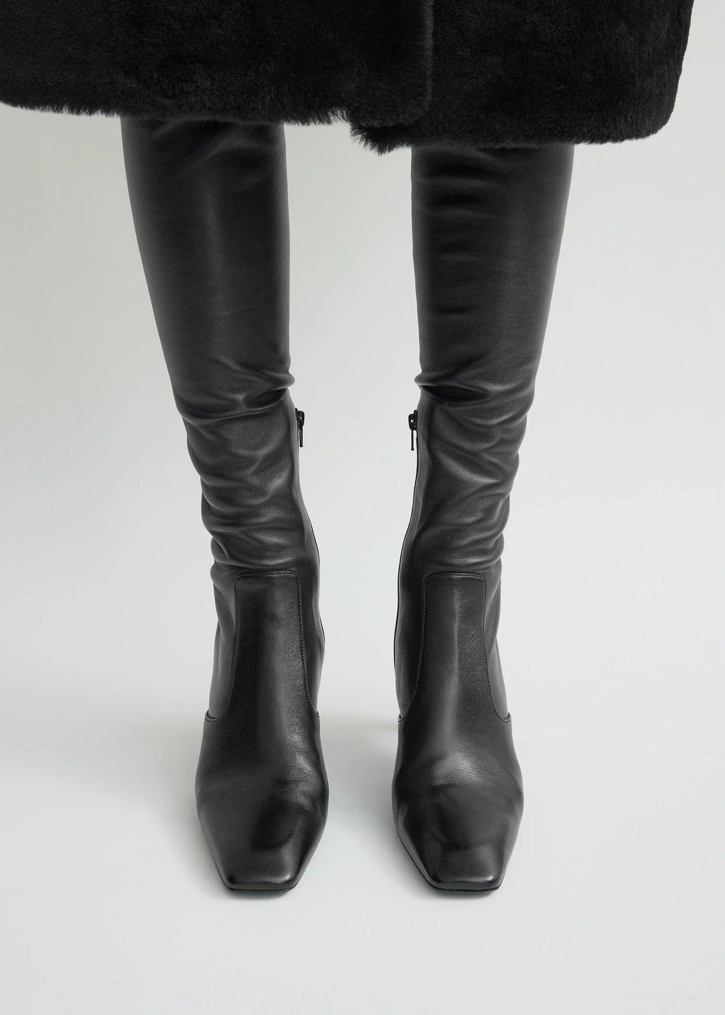 Fashionable Over-the-knee Boot in Black by TOTEME, featuring a comfortable second-skin fit.