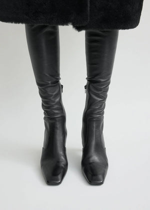 Fashionable Over-the-knee Boot in Black by TOTEME, featuring a comfortable second-skin fit.
