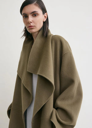Casual presentation of the TOTEME Signature Doublé Coat in Hazel, perfect for layering over cozy knits.
