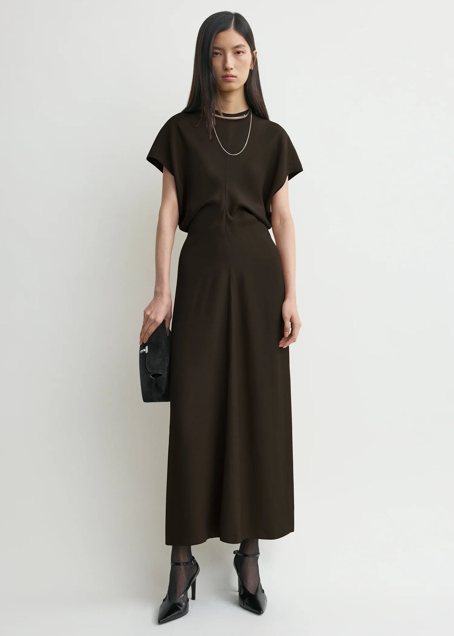 Close-up of the slouching waist design of TOTEME's Slouch Waist Dress in Bark.