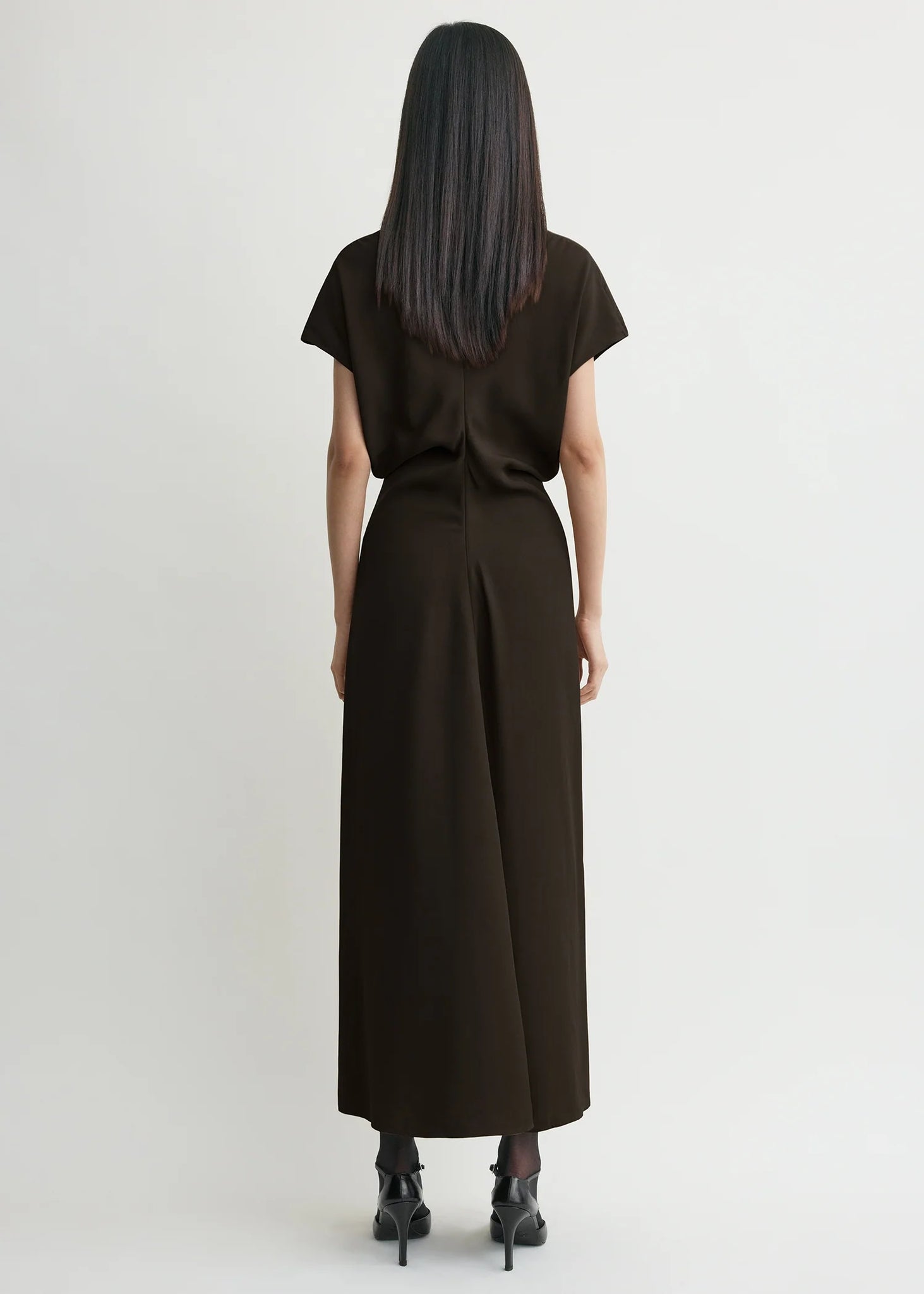 Back view of the TOTEME Slouch Waist Dress in Bark displaying the concealed back zipper.