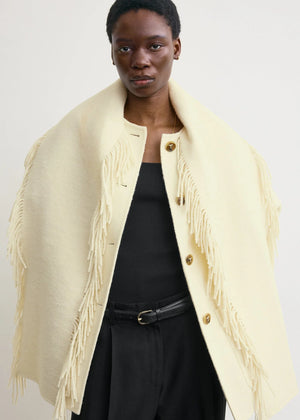 Side view of the Fringed Scarf Jacket in Winter White, emphasizing the patch pockets and trendy design.