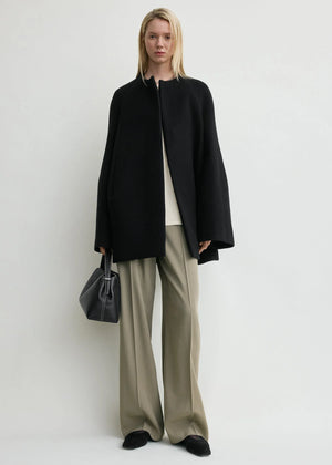 Close-up of the Bell-Sleeve Jacket in Black by TOTEME, highlighting the soft wool-blend felt fabric.
