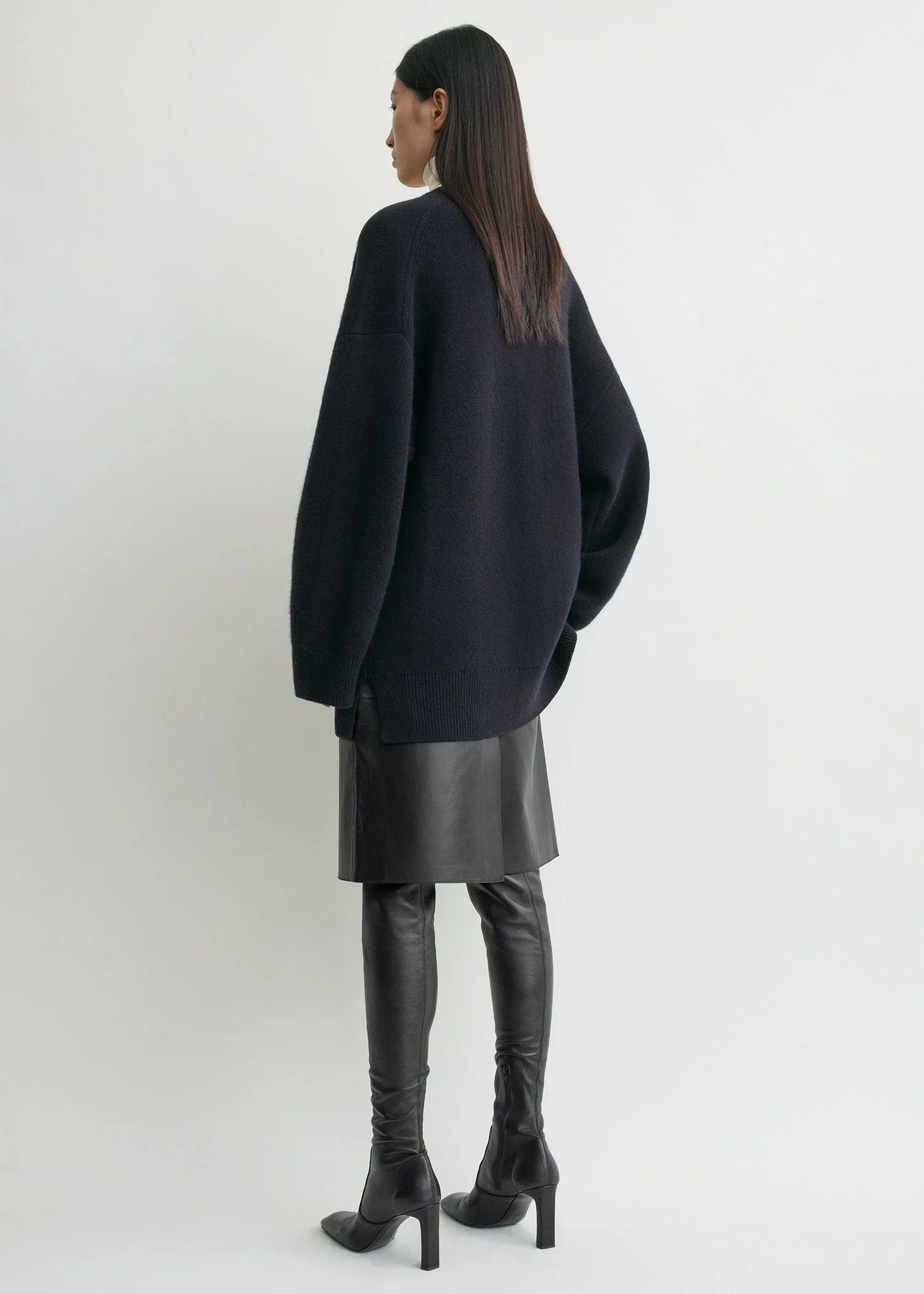 Chic Longline Cardigan in Navy by TOTEME, showcasing its warm cashmere blend and buttoned placket.