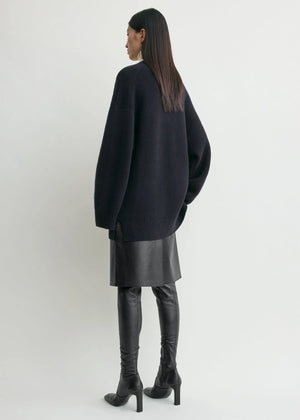 Chic Longline Cardigan in Navy by TOTEME, showcasing its warm cashmere blend and buttoned placket.