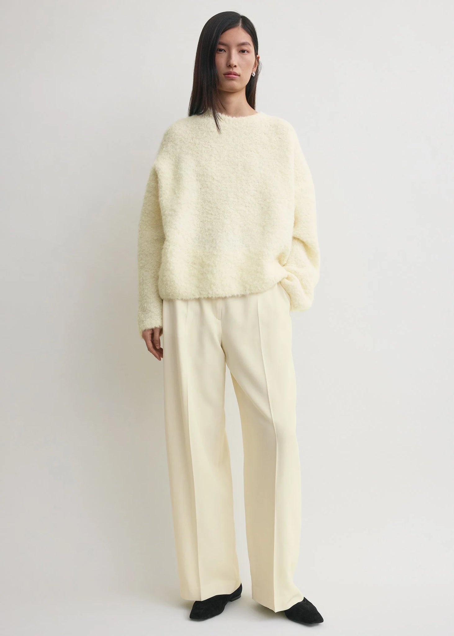 Close-up of the Boxy Boucle Knit in Milk, highlighting the soft teddy-like feel and oversized fit.