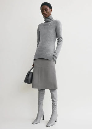 High-neck Double Knit Sweater in Pale Grey Melange displayed on a mannequin with a ribbed edge detail.