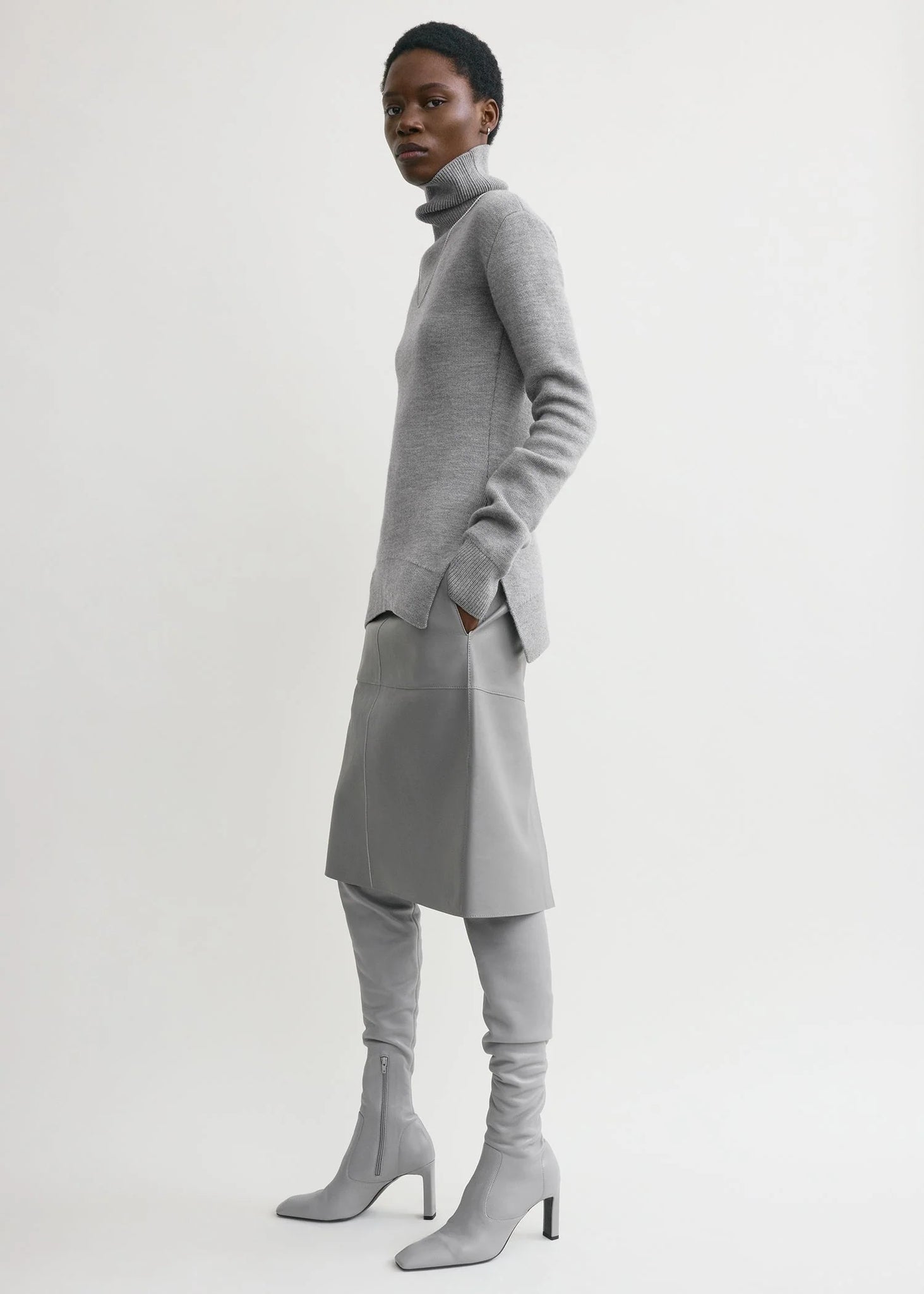 Close-up view of the High-neck Double Knit Sweater in Pale Grey Melange, highlighting the cashmere blend texture.
