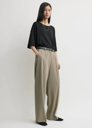 Wide Fluid Trousers in Taupe styled with a tucked-in top for an elegant look by TOTEME.