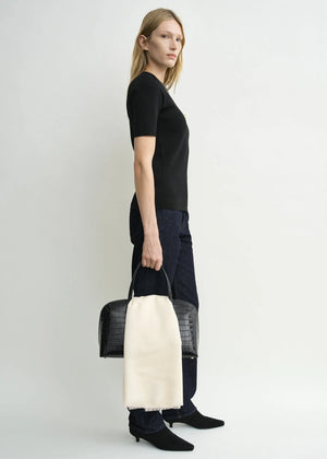 Back view of the Compact Knit Top in Black, designed by TOTEME with a clean and modern look.