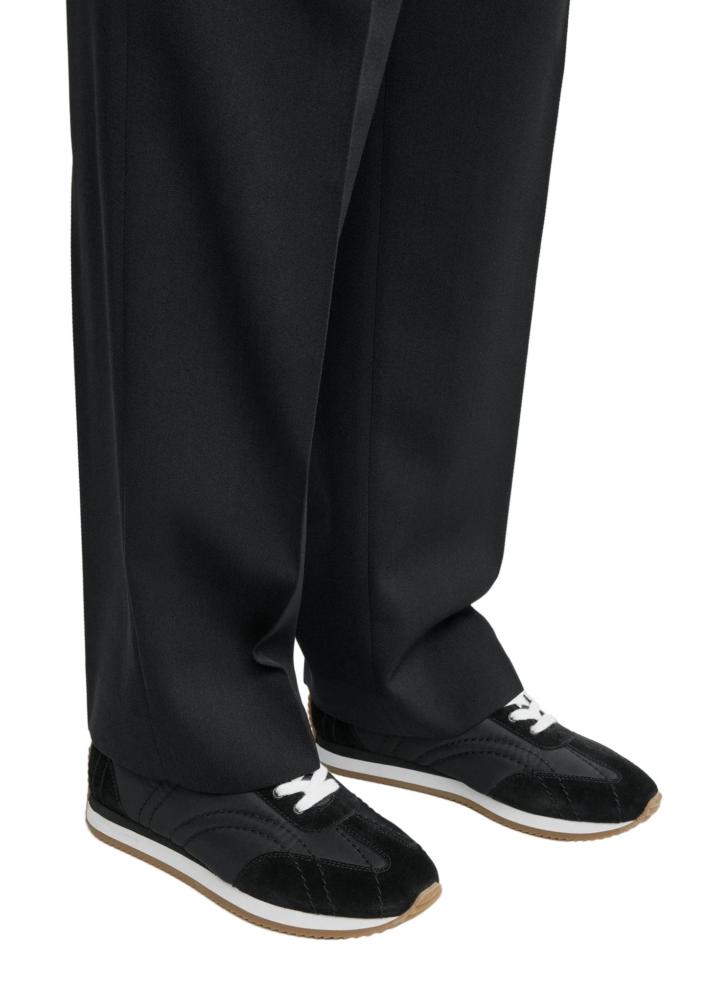 Stylish Sport Sneakers in Black on display, showcasing a comfortable foam midsole.