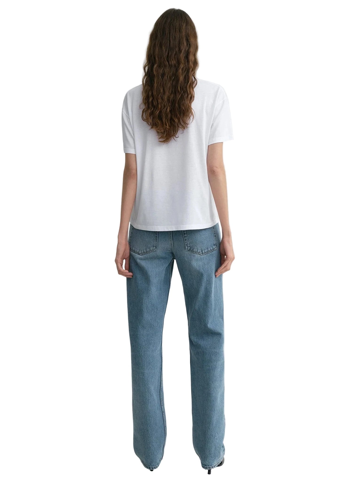 Back view of the Low Straight Jean in True Vintage by TOTEME, highlighting the straight leg silhouette.