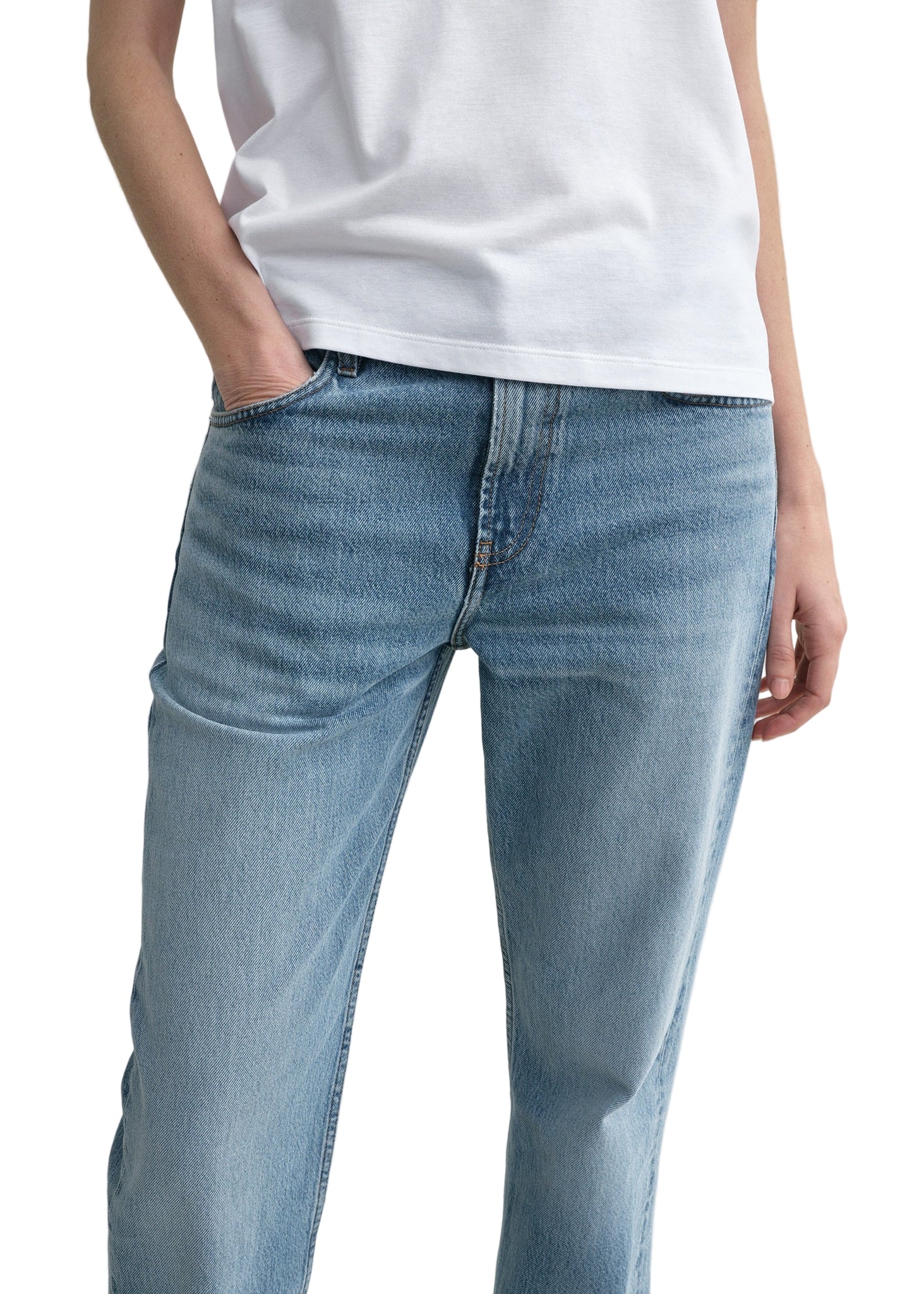Side view of the Low Straight Jean in True Vintage by TOTEME, demonstrating its low waist and relaxed fit.