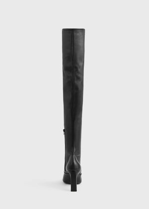 Elegant Over-the-knee Boot in Black, highlighting its contoured fit and high-quality lamb leather.