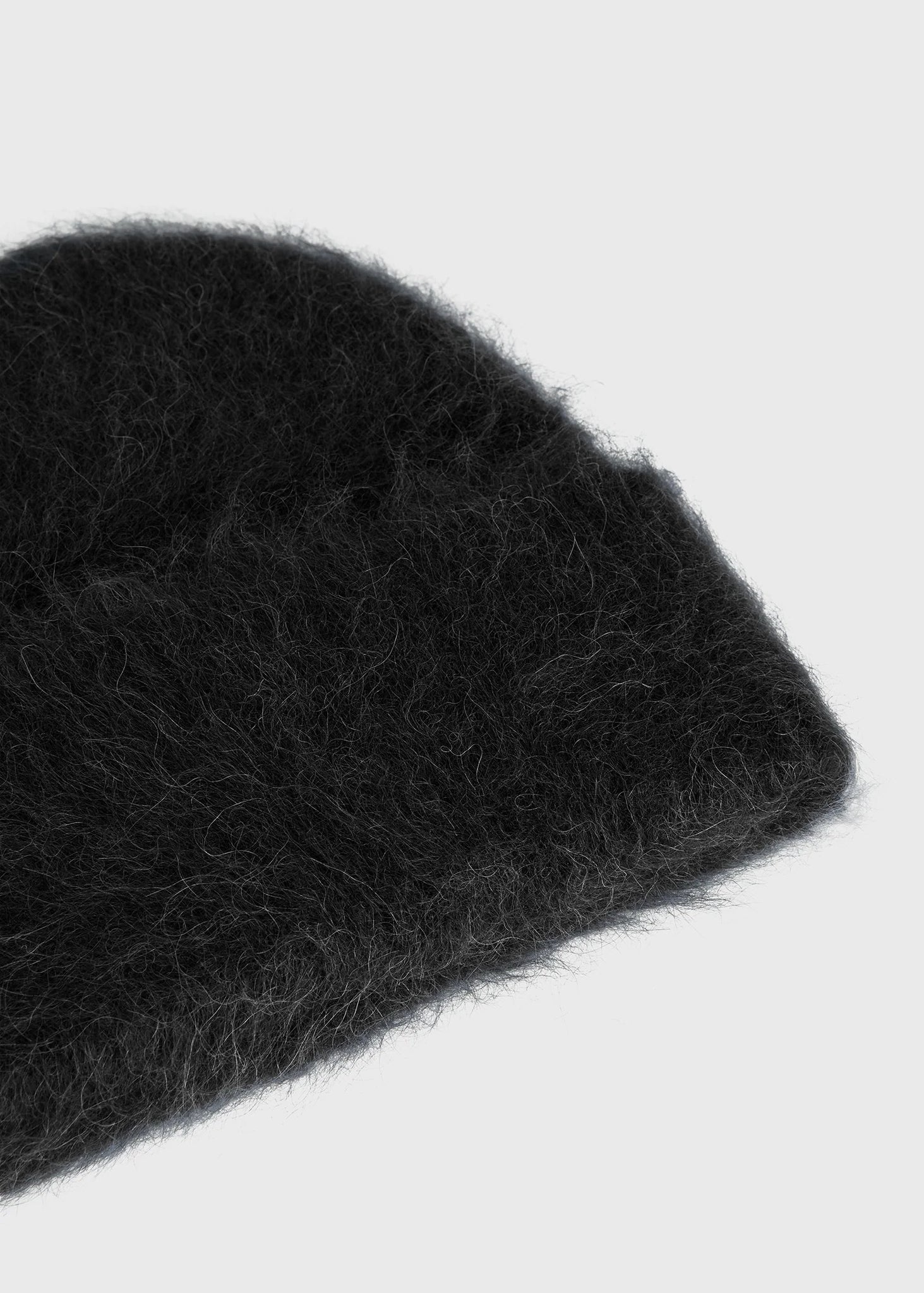 Alpaca Beanie Hat in Black by TOTEME, perfect for winter styling with versatile wear options.
