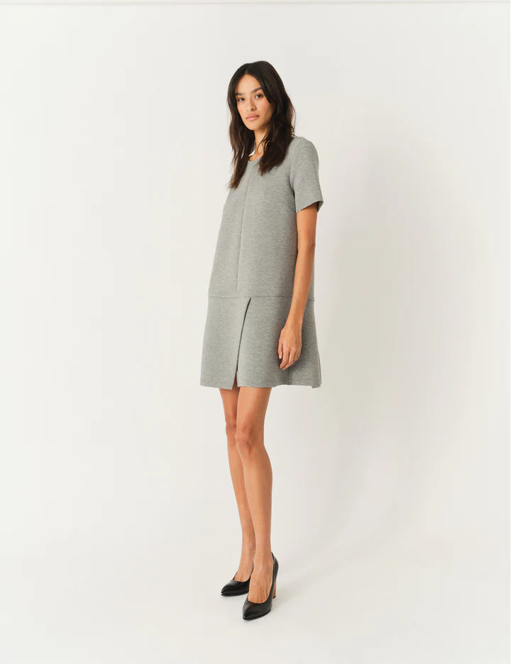 Side view of the Nice Mini Dress in Grey Melange showcasing its elegant silhouette by THE GARMENT.
