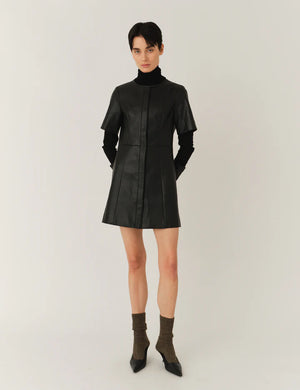 Detail of the Brooklyn Mini Dress in Black showing the round neckline and button placket.