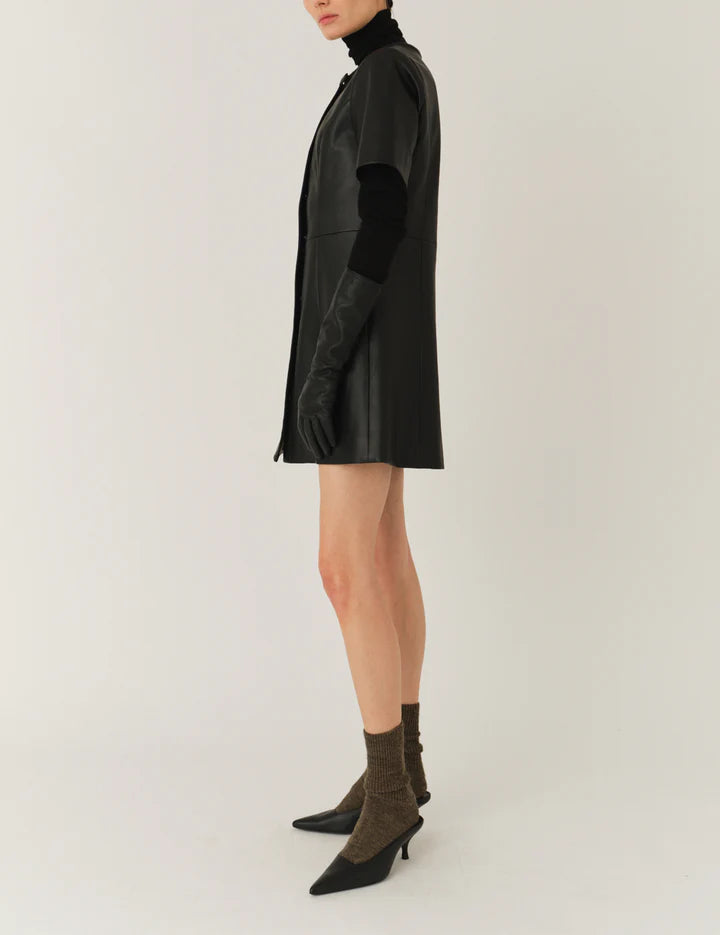 Model wearing the Brooklyn Mini Dress in Black demonstrating its fashionable design.