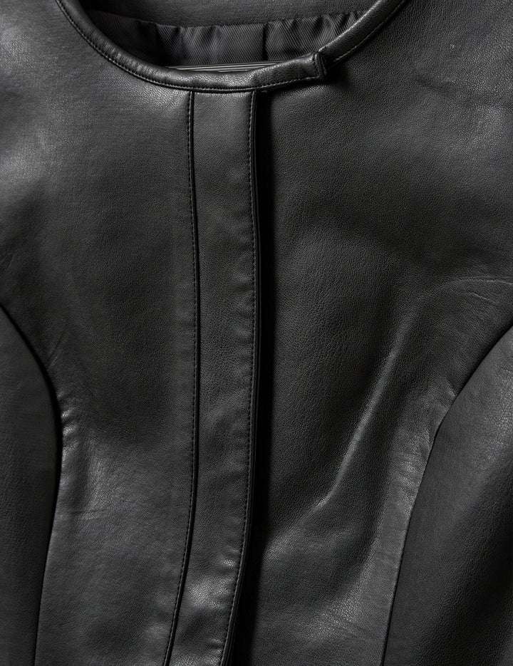 The Brooklyn Mini Dress in Black displayed on a hanger emphasizing its chic style.