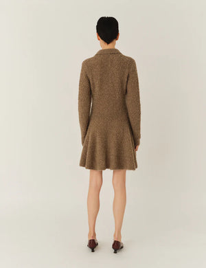 Model wearing the Balboa Volume Dress in Praline, perfect for modern stylish looks.