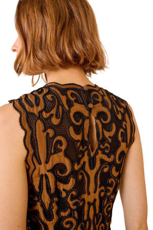 The flowy skirt of the Auryn Dress in Saffron made from pleated habotai fabric.