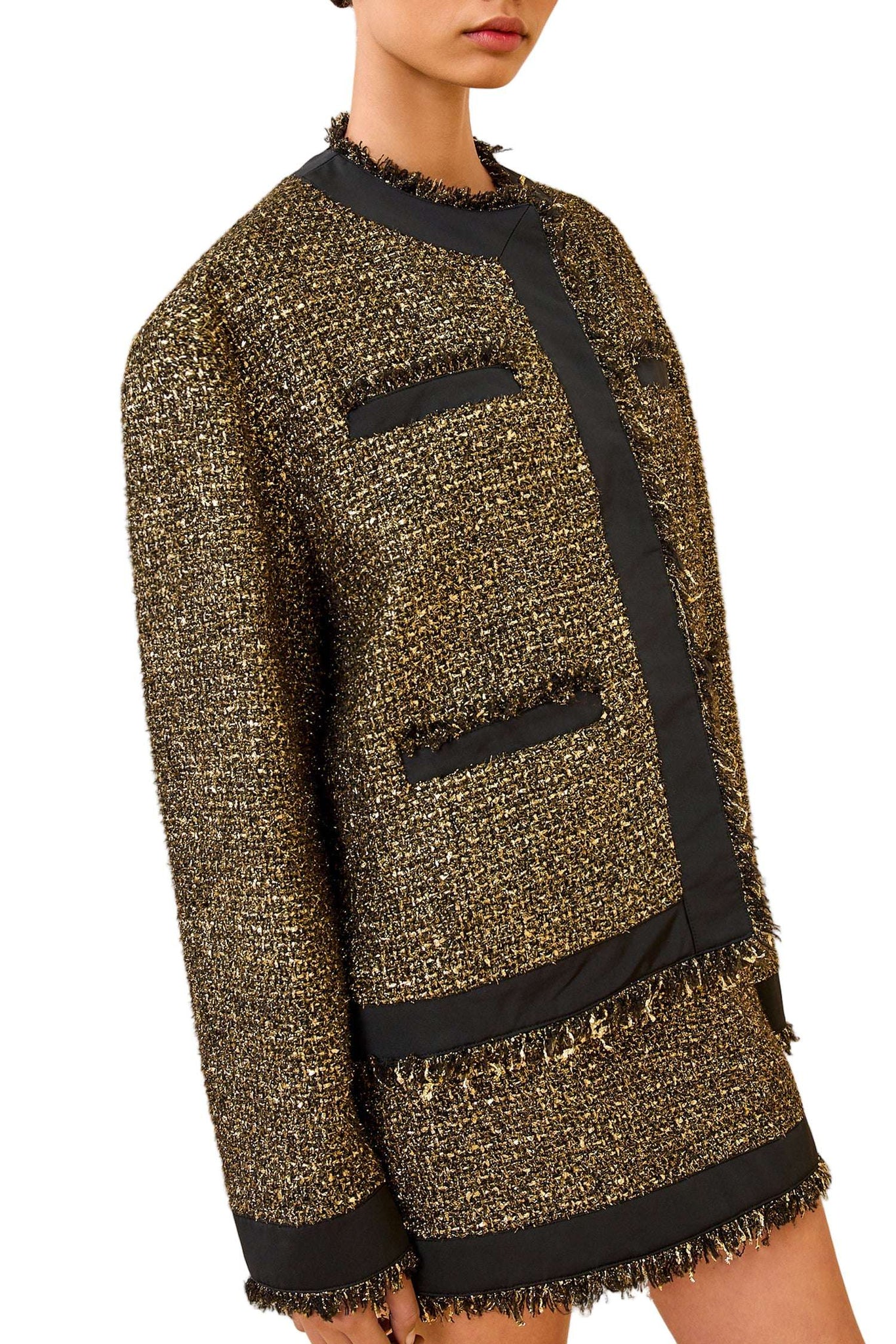 Styled look of the Ulla Johnson Carmella Tweed Coat in Tapestry paired with the Aleena Skirt for a complete modern outfit.