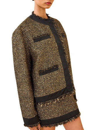 Styled look of the Ulla Johnson Carmella Tweed Coat in Tapestry paired with the Aleena Skirt for a complete modern outfit.