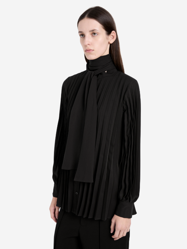 Fashion model wearing the Soomin Top in Black by Proenza Schouler, demonstrating a stylish look.