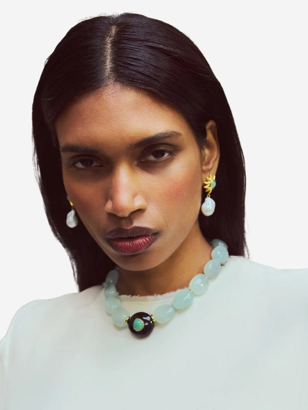 Close-up of the Andalusia Collar in Sea Foam showcasing turquoise and gold-fill accent beads along with the focal black resin and chrysoprase design by Lizzie Fortunato.