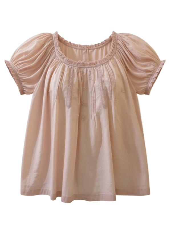 Frederica Top in Blush by Dôen, featuring a soft organic cotton voile design, rounded neckline, short puffed sleeves with scalloped lace, pintuck details, floral embroidery, perfect for a chic, elegant look.