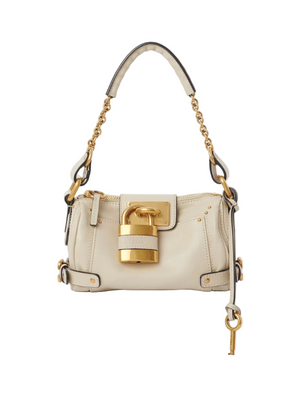 Small Paddington Chain Bag in Cloudy Cream by Chloé, made from grained buffalo leather, featuring a slouchy silhouette, oversized padlock, and adjustable leather strap.