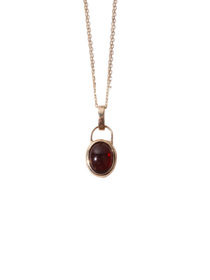 Scarlet Amulet Pendant in Garnet featuring a stunning 14kt gold bezel and deep red garnet stone, perfect for layering or wearing solo.