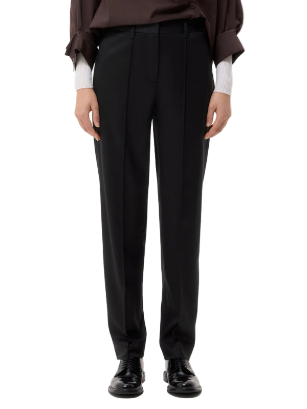 Harrison Pant in Black by TWP displayed on a mannequin showing the slim, straight leg design in refined wool suiting.