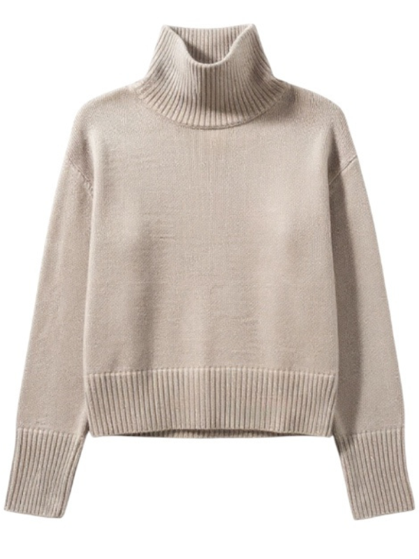 Fleur Sweater in Sand featuring a luxurious ribbed-knit cashmere fabric, showcasing a boxy silhouette and a loose turtleneck, ideal for elegant layering.