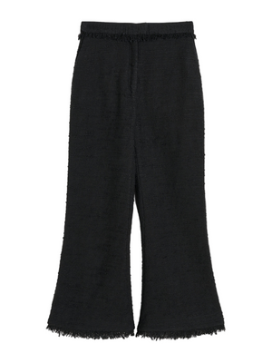 Mafaldana Boucle Trousers in Black displayed on a model showcasing the trendy cropped design and chic side pockets.