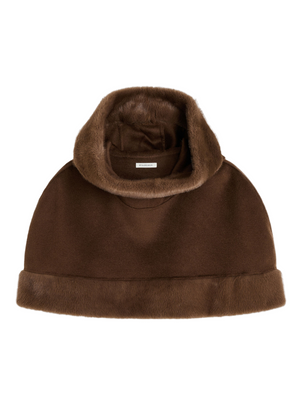 Marta Wool Cape in Carafe displayed elegantly against a neutral background with faux fur trim and hood, perfect for adding allure to eveningwear.
