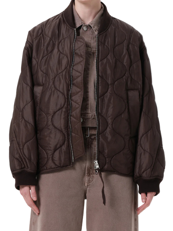 Isla Quilted Jacket in Bourbon showcasing its relaxed silhouette and zip-front closure.