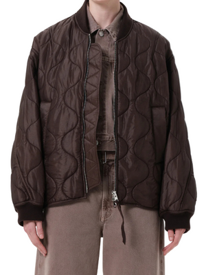 Isla Quilted Jacket in Bourbon showcasing its relaxed silhouette and zip-front closure.