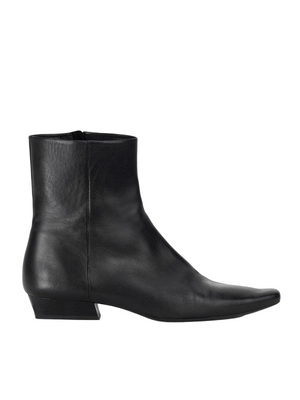 Wally Flat Ankle Boot in Black by Staud, showcasing its sleek design and pointed rectangular toe.